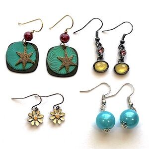 Four pairs of dangly drop earrings